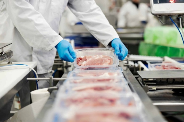 Close,Up,Of,A,Meat,Industry,Worker,Gathering,Packed,Meat